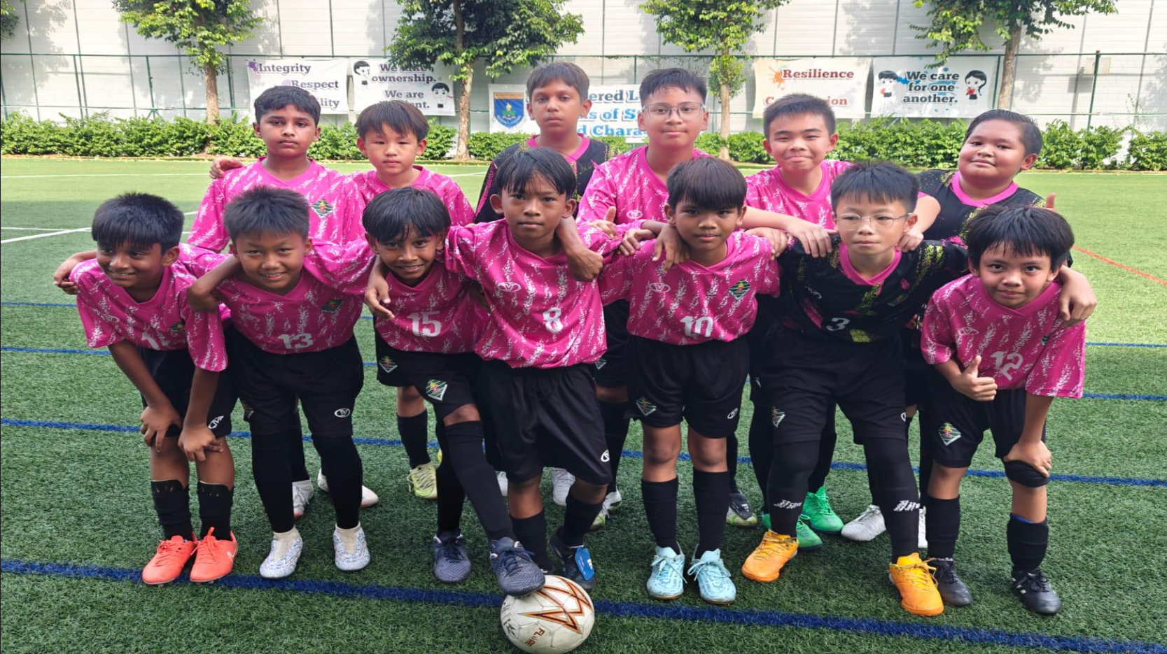 The boys posing for a group photo before the start of match.